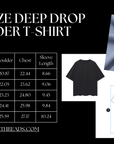 Camiseta gráfica Enby & Trans Pride estilo urbano con hombros caídos y corazón cromado negro de gran tamaño - 190 g/m²