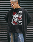 Brown Boi Skull and Red Roses Graphic Chicano Streetwear Style on Front of Black Oversize Deep Drop Shoulder Tee - 190 GSM