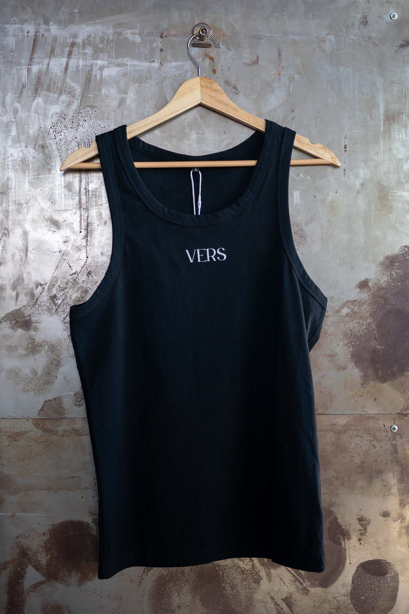 VERS Pride Tank Minimal on front of Black High Performance Tank Top High Performance Tank Top