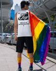 NYC Top Tank Book your Reservations Gay Pride on back of Relaxed Fit Sleeveless Tank Top Relaxed Fit T-Shirt