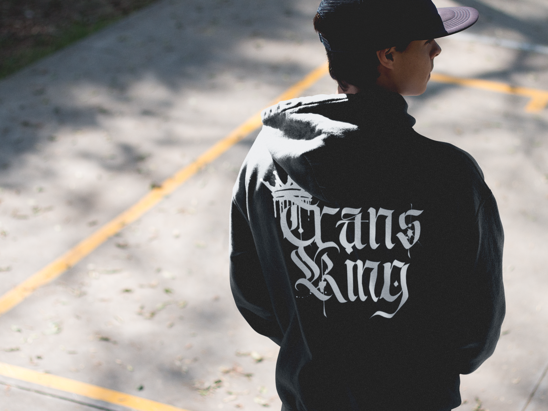 Trans King with a Crown Spray Paint Graffiti Style Streetwear Hoodie Gender Diversity Trans Pride on back of Black or Gray Eco Raglan Hoodie