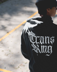 Trans King with a Crown Spray Paint Graffiti Style Streetwear Hoodie Gender Diversity Trans Pride on back of Black or Gray Eco Raglan Hoodie