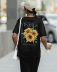 Sunflower Hidden Disabilities Pride Shirt on back of Black Oversize Deep Drop Shoulder Tee Oversize Deep Drop Shoulder Tee - 190 GSM