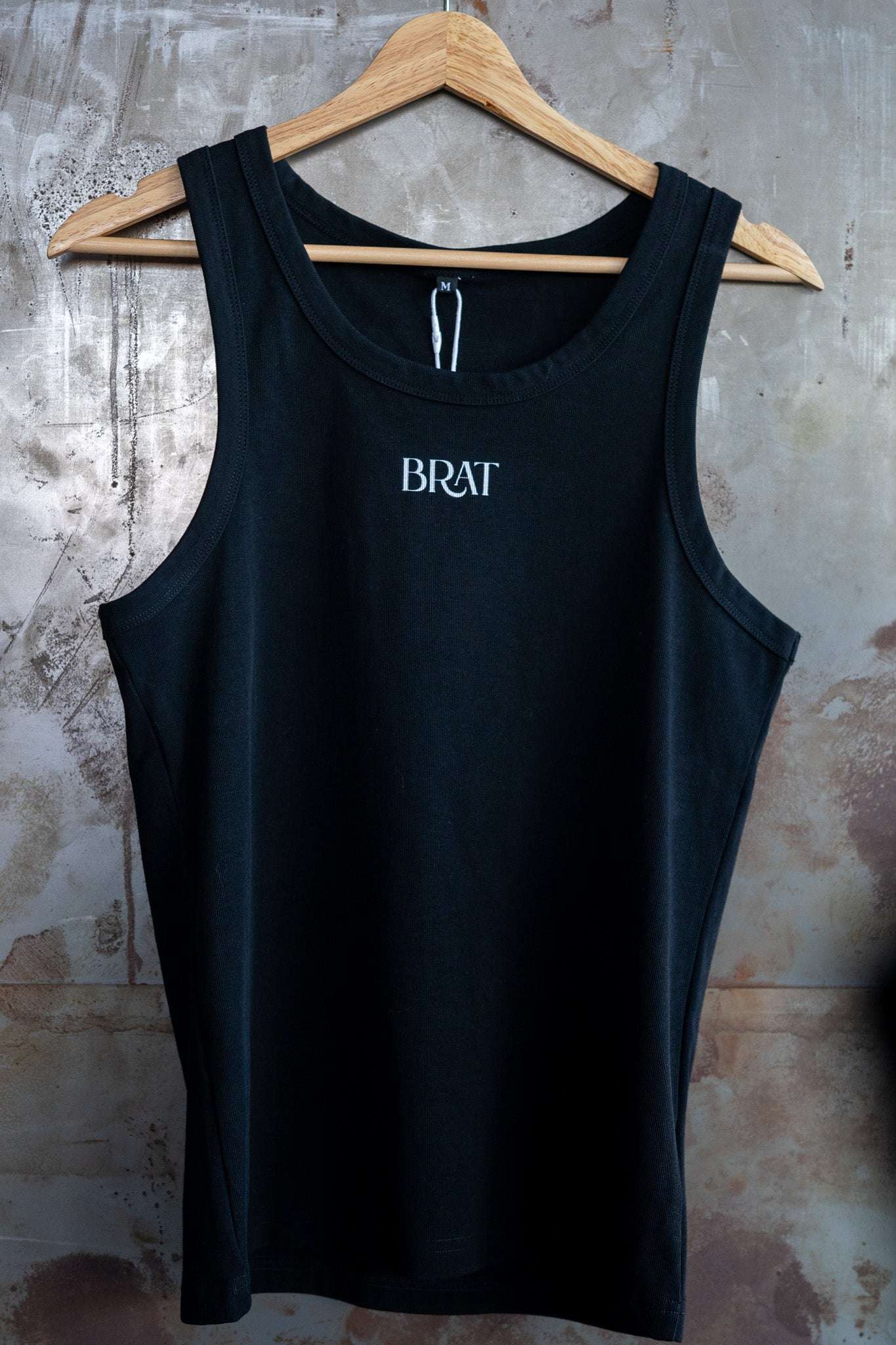 Brat Pride Tank Minimal on front of Black High Performance Tank Top High Performance Tank Top