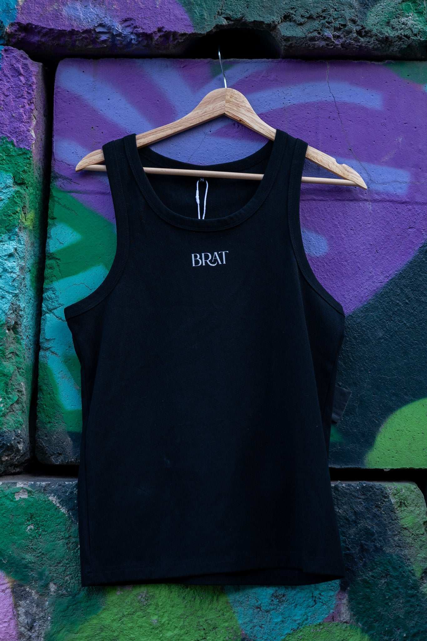 Brat Pride Tank Minimal on front of Black High Performance Tank Top High Performance Tank Top