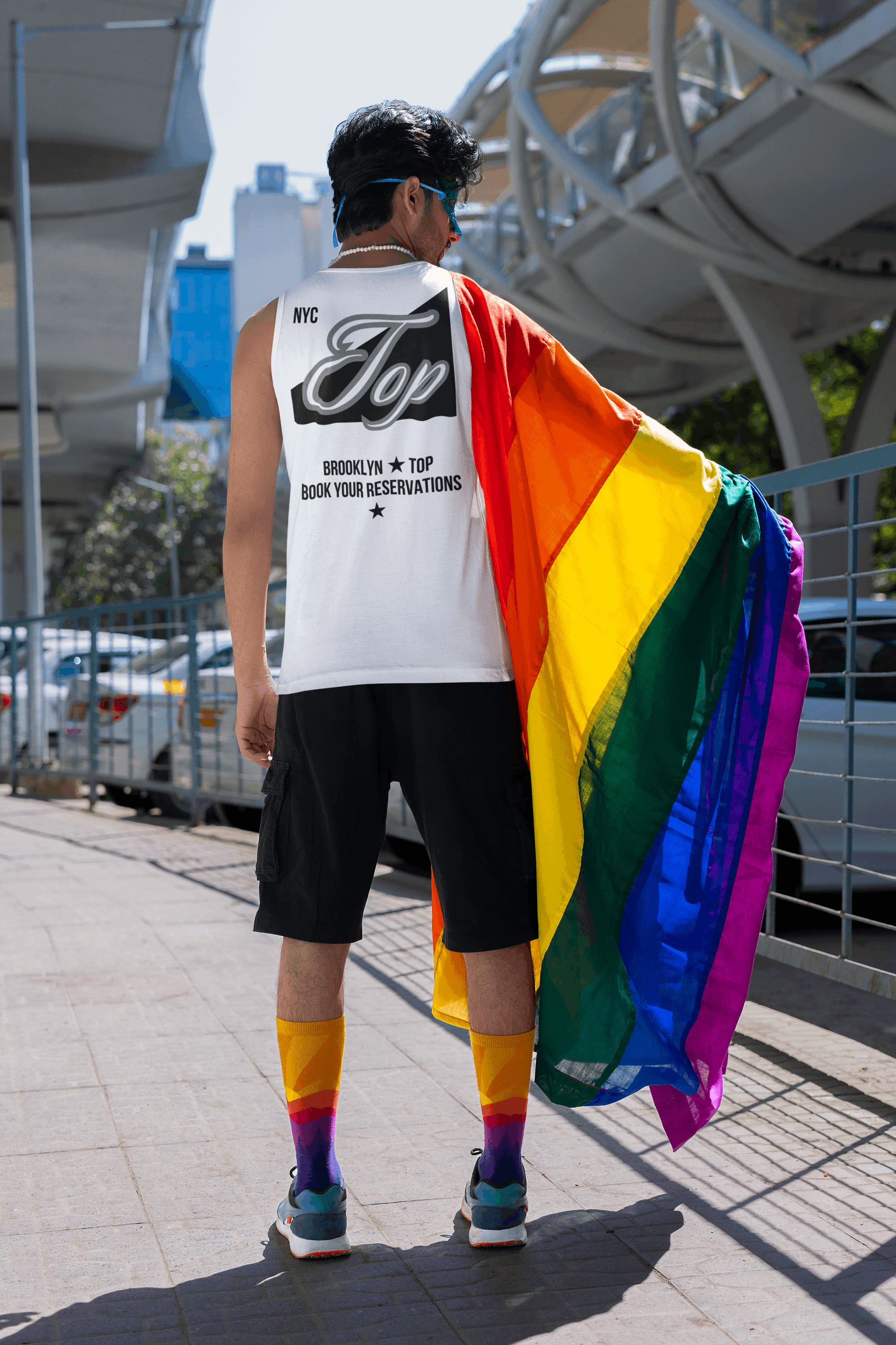 NYC Top Tank Book your Reservations Gay Pride on back of Relaxed Fit Sleeveless Tank Top Relaxed Fit T-Shirt