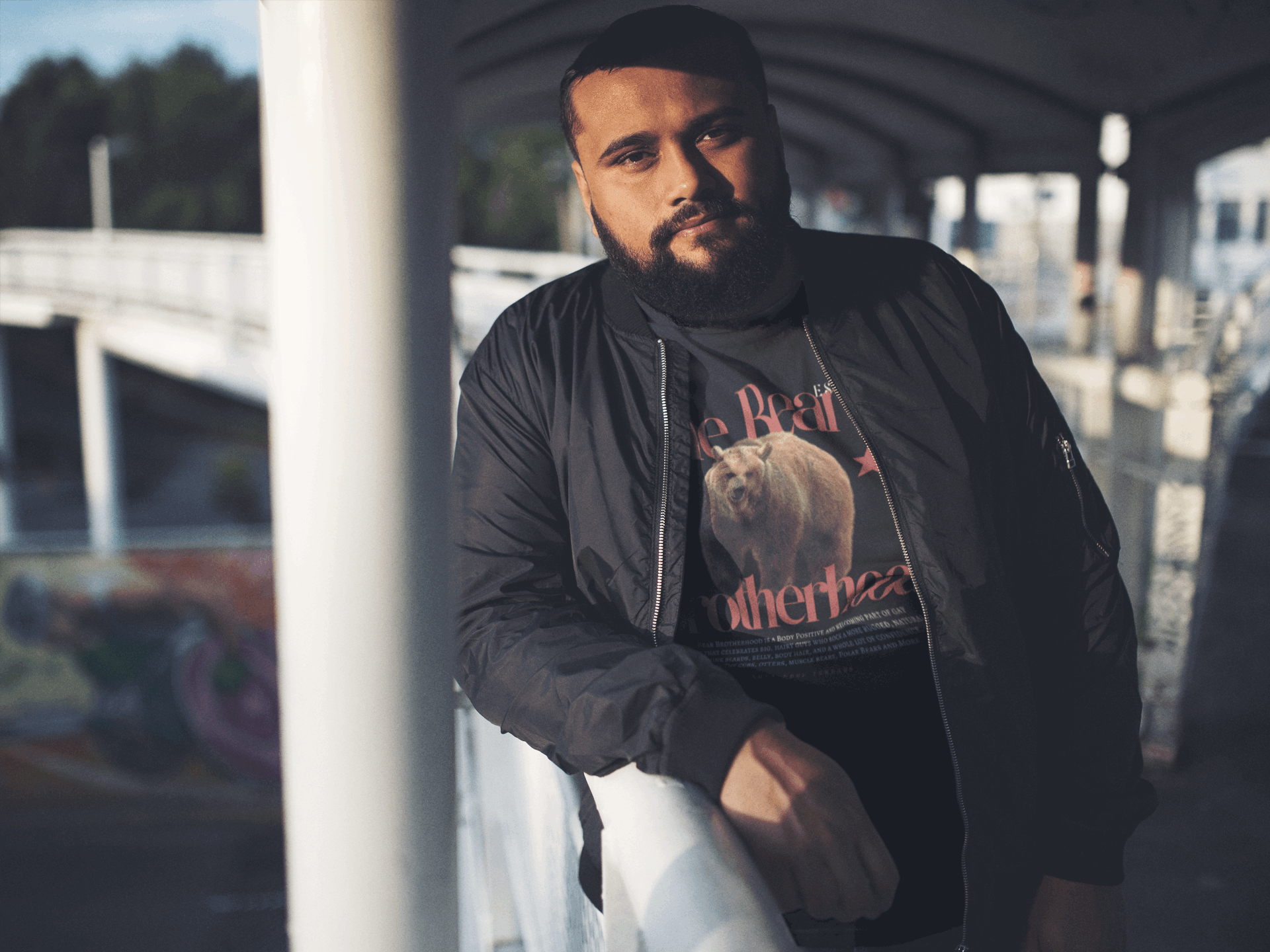The Bear Brotherhood Gay Pride T-Shirt on front of Black Oversize Deep Drop Shoulder Tee