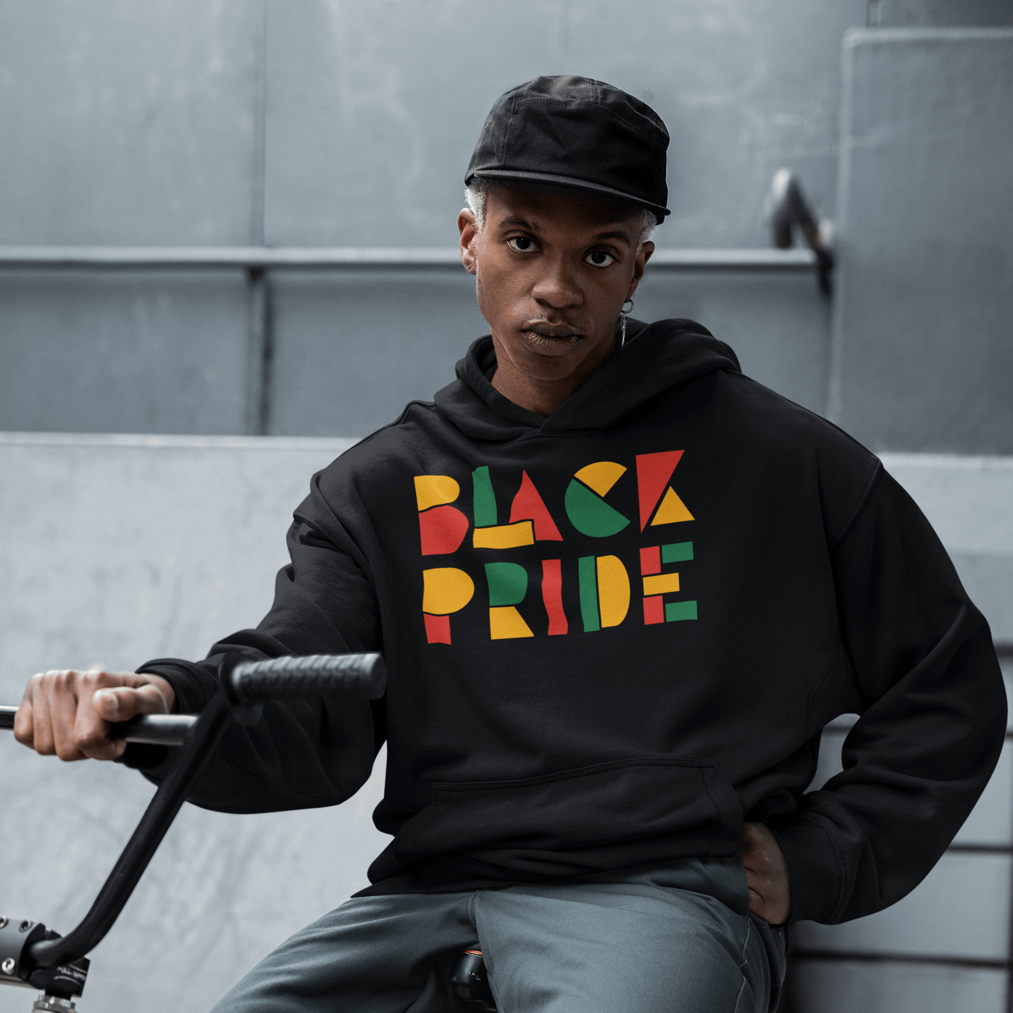 Black Pride Hoodie Red Green and Yellow Geometric Design on Black Eco Friendly Raglan Hoodie